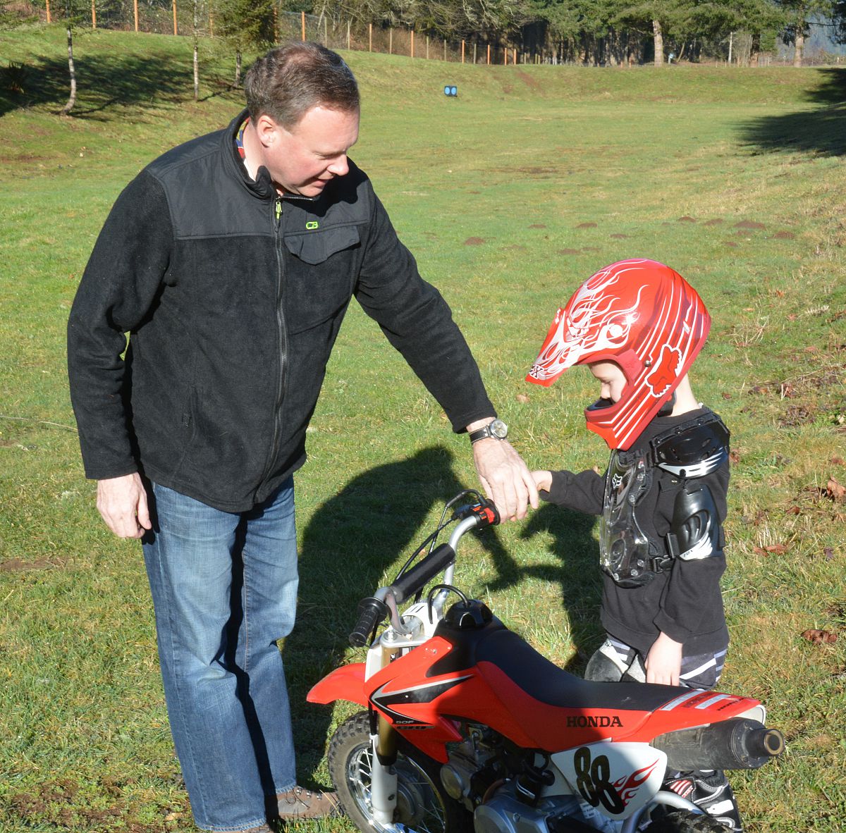 Learning what the throttle does - from the Dirt Biking with Miriam and Rodney photo gallery.