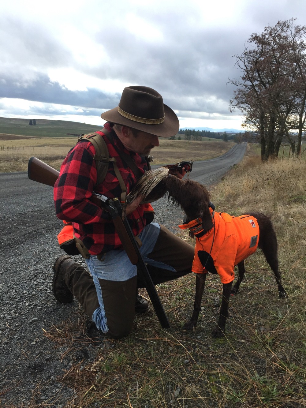 Gary and his dog Liesl and a pheasant - from the Hungarian Partridge and Pheasants - Double Barrel Ranch photo gallery.