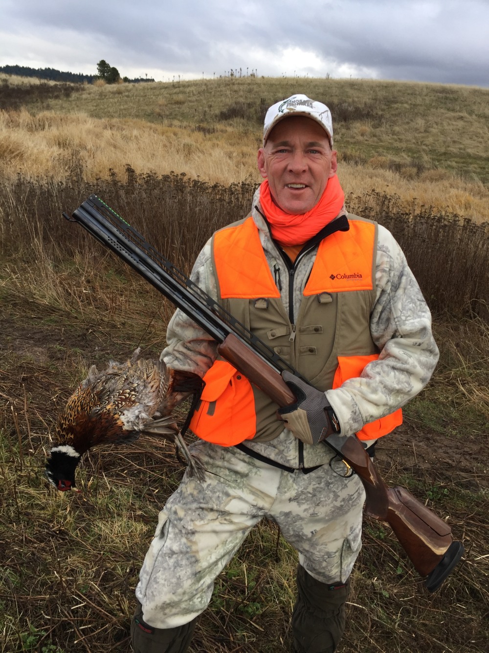 Rodney Smith and a pheasant - from the Hungarian Partridge and Pheasants - Double Barrel Ranch photo gallery.