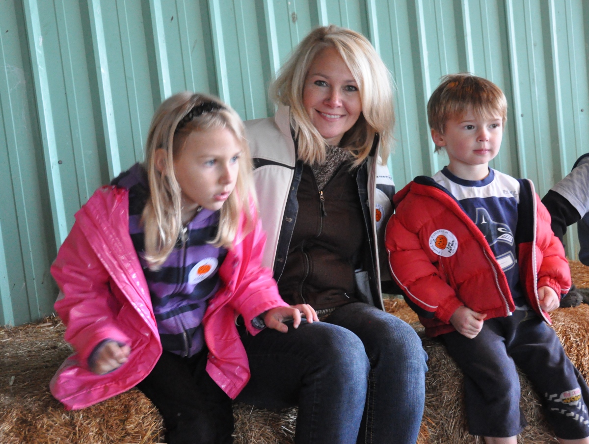 Sitting on the hay bales, learning about pumpkins - from the Pumpkin Adventures 2011 photo gallery.